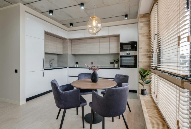 Kitchen table, cabinets, and oven / stove. The best apartment cleaning in Moose Jaw.